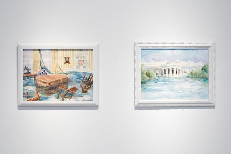 Photo of two framed watercolor paintings on a white wall